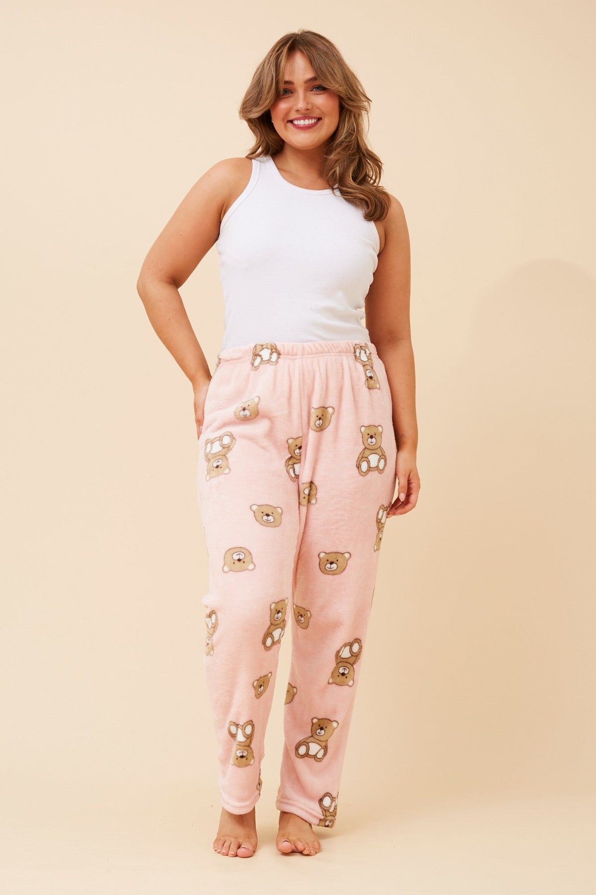 Image of a model wearing Pants. Product name - LEE TEDDY BEAR PLUSH PYJAMA PANT in Pink colour by brand - Caroline Morgan Australia
