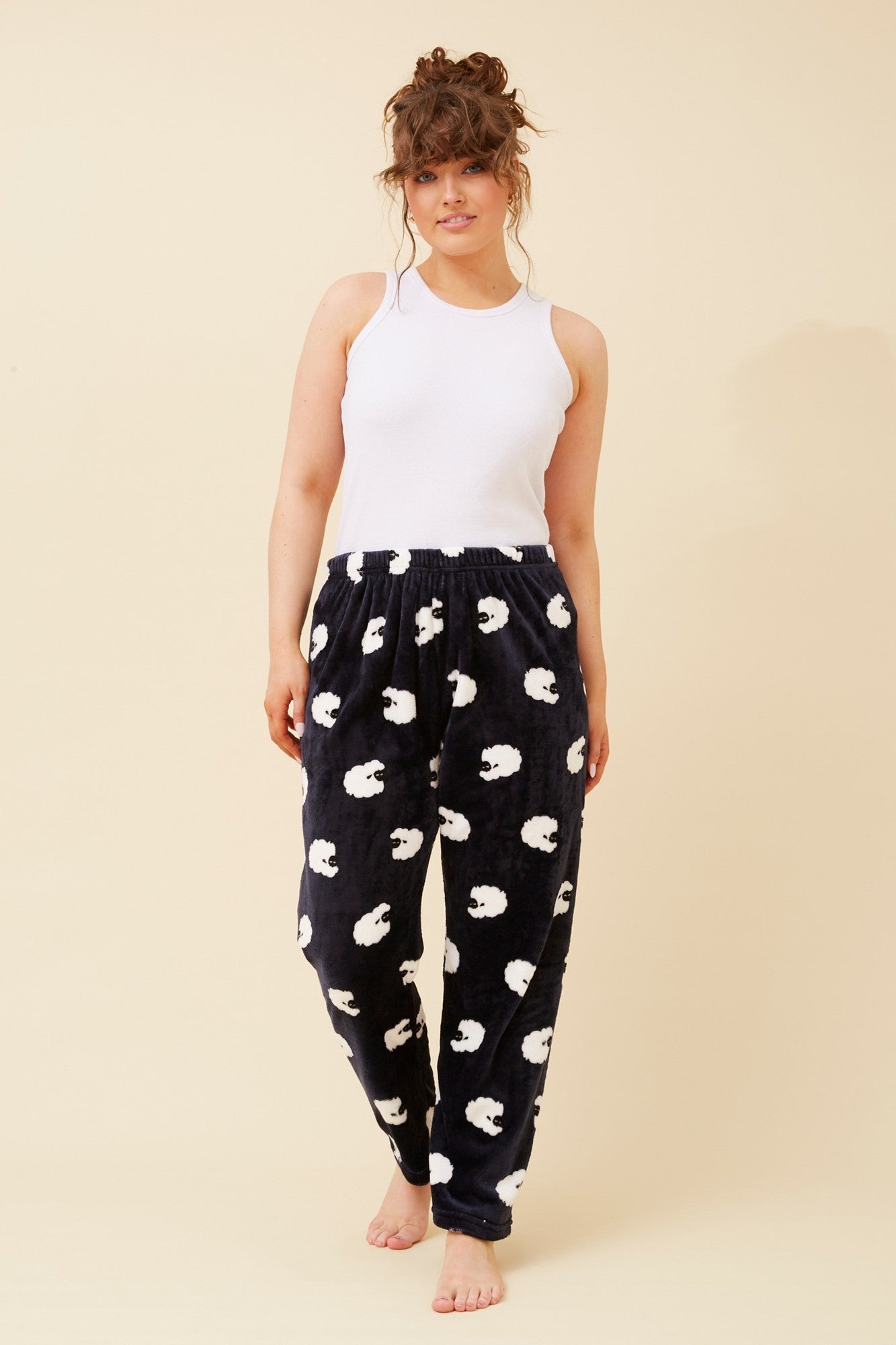 Image of a model wearing Pants. Product name - LEE PLUSH PYJAMA PANTS in Navy colour by brand - Caroline Morgan Australia