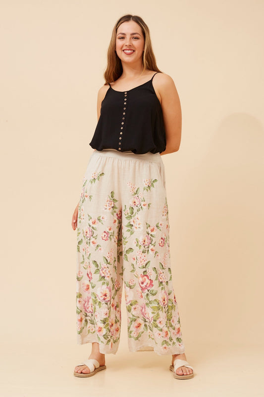 Image of a model wearing Pants. Product name - LEONORA FLORAL WIDE LEG LINEN PANTS in Linen colour by brand - BOTTEGA MODA