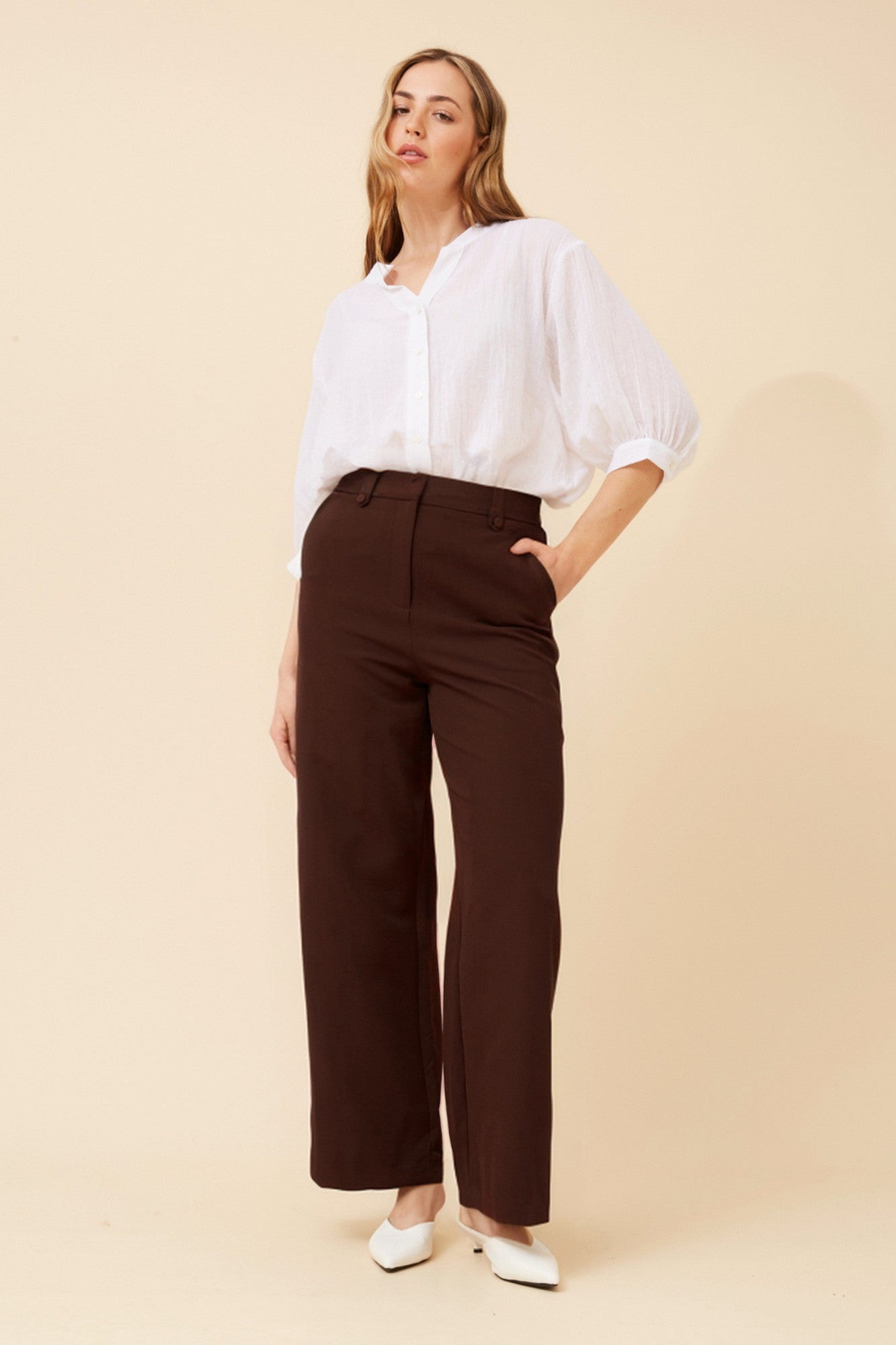 Image of a model wearing Pants. Product name - SAHARA WIDE LEG PANTS in Khaki colour by brand - Caroline Morgan Australia