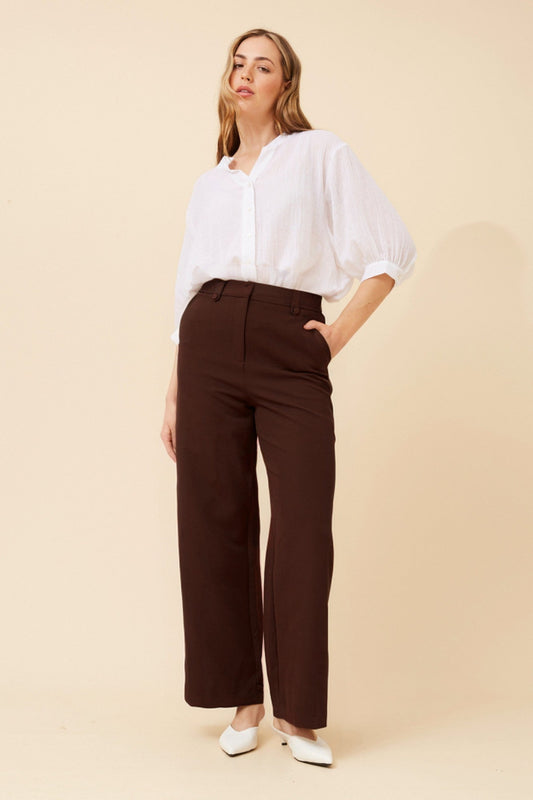 Image of a model wearing Pants. Product name - SAHARA WIDE LEG PANTS in Khaki colour by brand - Caroline Morgan Australia