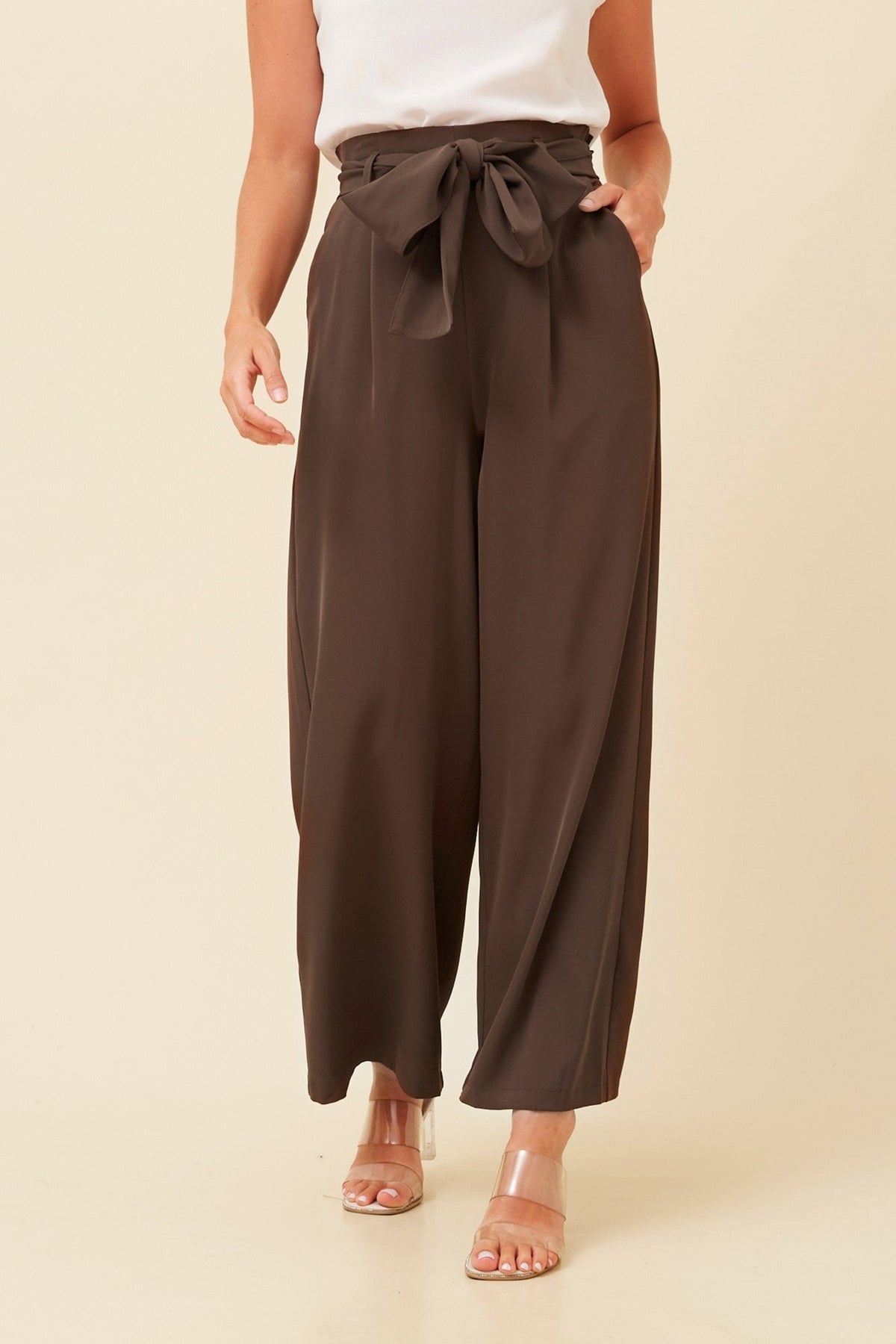 Image of a model wearing Pants. Product name - WINIFRED PAPER BAG PANTS in Chocolate colour by brand - Caroline Morgan Australia