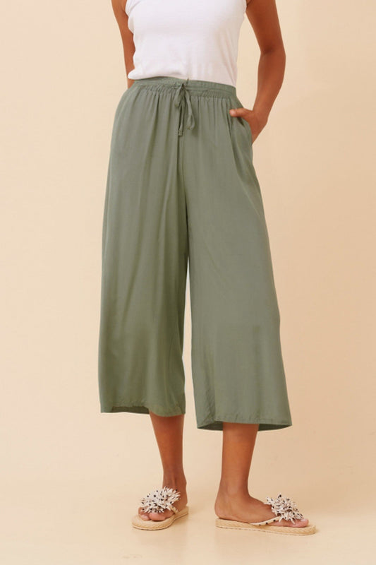 Image of a model wearing Pants. Product name - SUZE SOLID CULOTTE PANTS in Khaki colour by brand - Caroline Morgan Australia