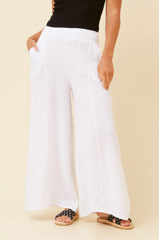 Image of a model wearing Pants. Product name - AMILITA WIDE LEG LINEN PANTS in White colour by brand - BOTTEGA MODA