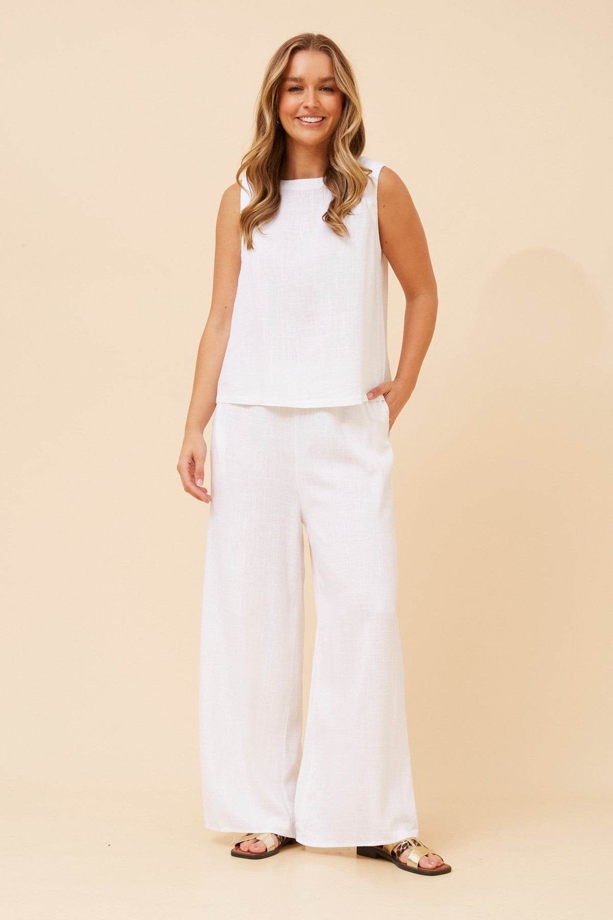 Image of a model wearing Pants. Product name - DONNY LINEN BLEND PANTS in Black colour by brand - Caroline Morgan Australia