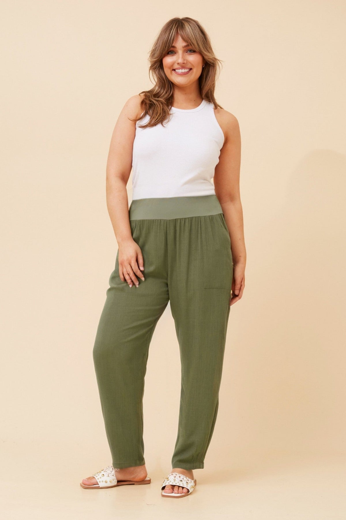 Image of a model wearing Pants. Product name - NEROLA LINEN PANTS in Black colour by brand - Caroline Morgan Australia