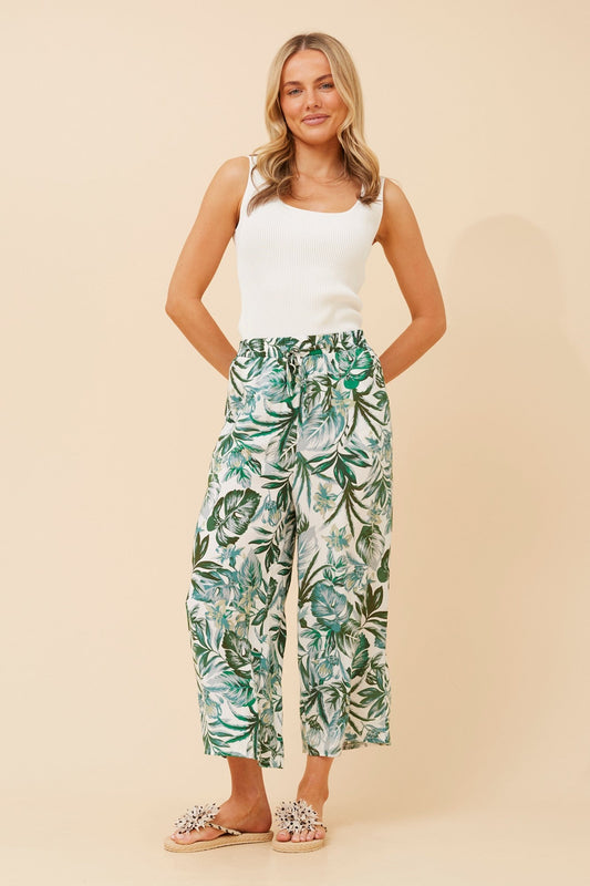Image of a model wearing Pants. Product name - SUZE LEAF PRINT CULOTTES in Multi Green colour by brand - Caroline Morgan Australia