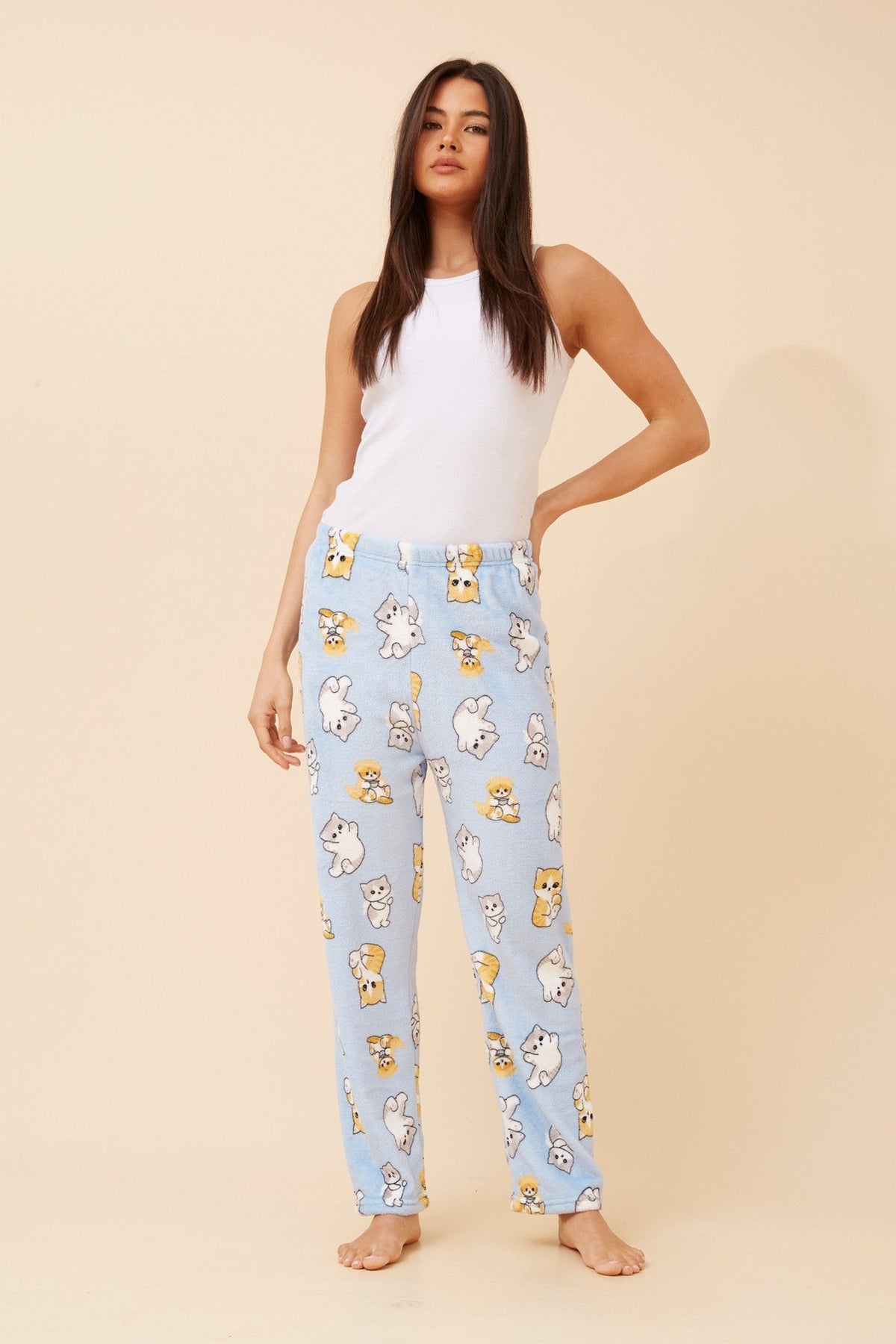 Image of a model wearing Pants. Product name - LEE CAT PRINT PYJAMA PANTS in Light Blue colour by brand - Caroline Morgan Australia