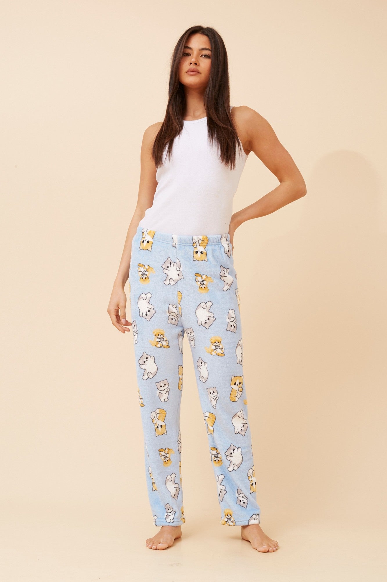 Image of a model wearing Pants. Product name - LEE CAT PRINT PYJAMA PANTS in Light Blue colour by brand - Caroline Morgan Australia
