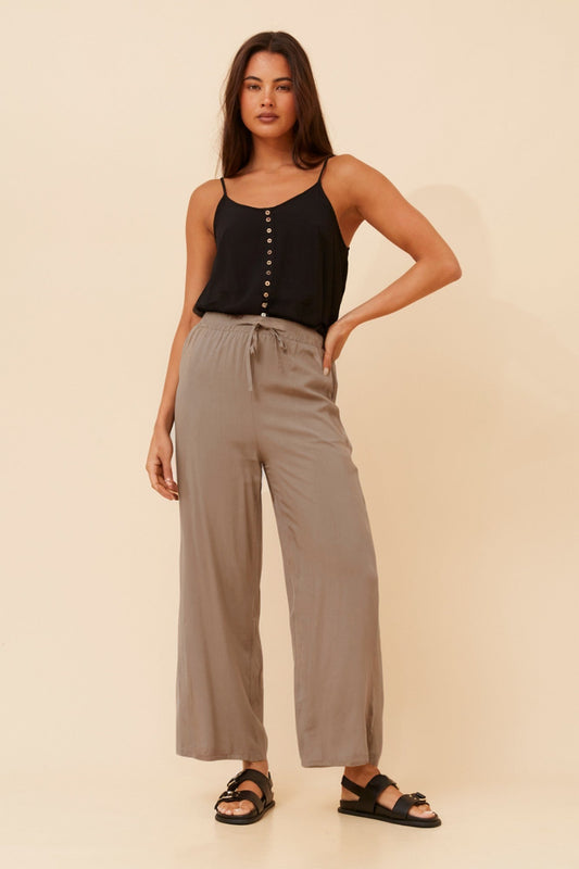 Image of a model wearing Pants. Product name - SUZZEL SOLID WIDE LEG PANTS in Taupe colour by brand - Caroline Morgan Australia