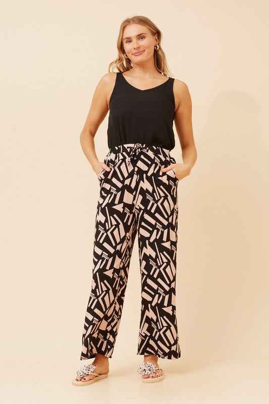 Image of a model wearing Pants. Product name - SUZZEL ABSTRACT PRINT PANTS in Black colour by brand - Caroline Morgan Australia