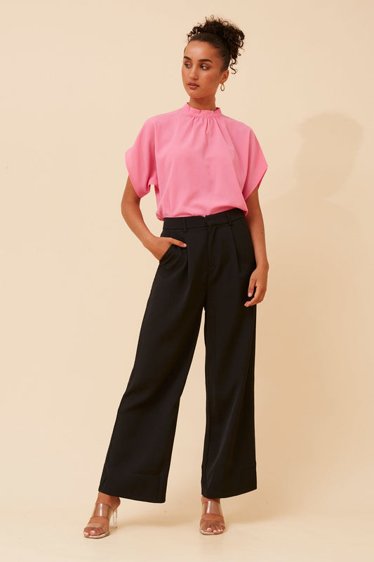 Image of a model wearing Pants. Product name - MAHA SOLID WIDE LEG PANTS in Black colour by brand - Caroline Morgan Australia