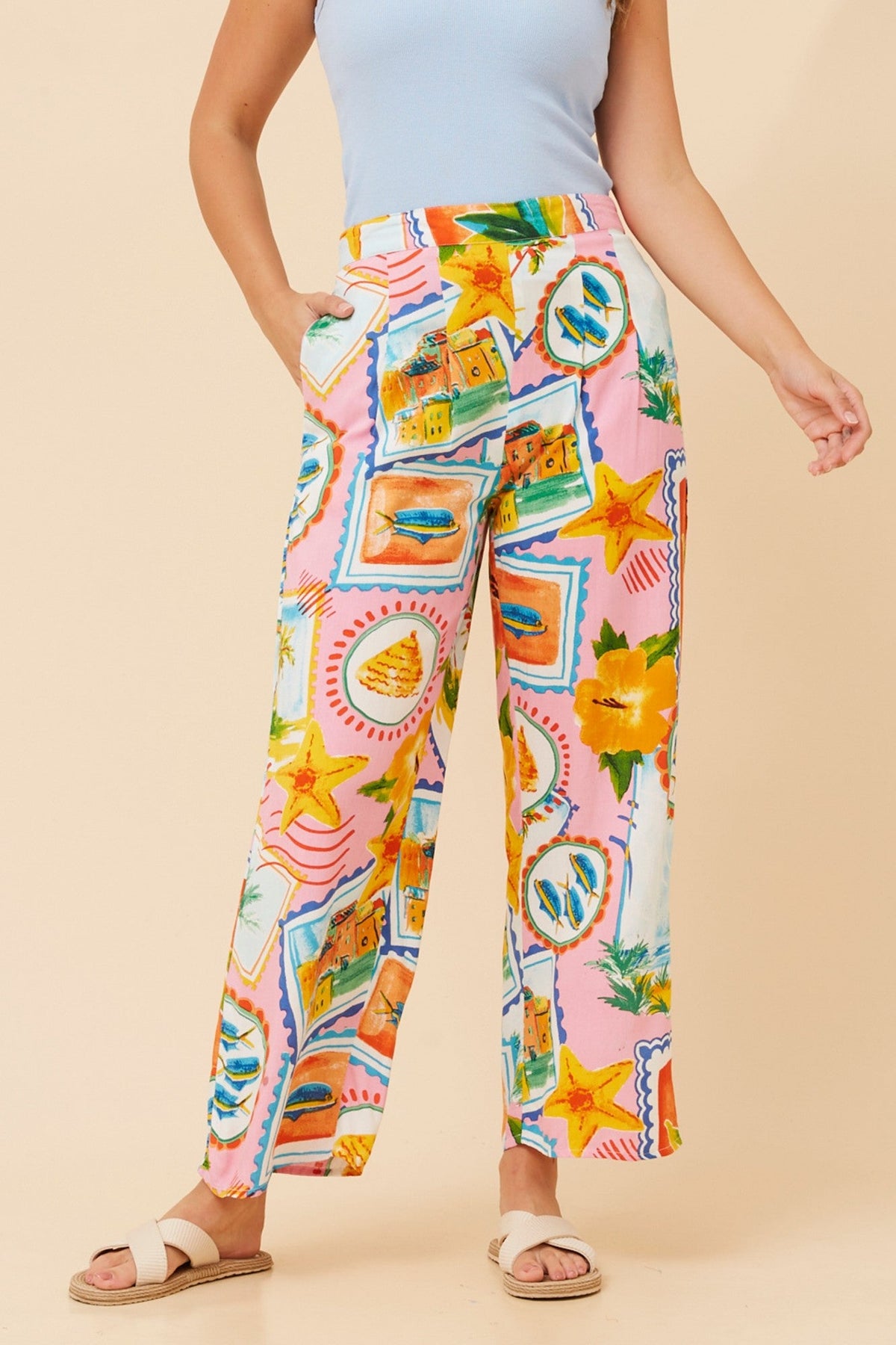 Image of a model wearing Pants. Product name - AKARIA PATCHWORK PRINT PANTS in Multi Pink colour by brand - MYSTIC MONSOON