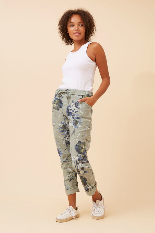 Image of a model wearing Pants. Product name - JANJA FLORAL JOGGER PANTS in Sage colour by brand - BOTTEGA MODA