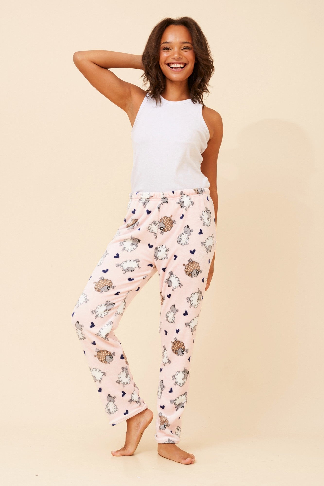 Image of a model wearing Pants. Product name - LEE SHEEP PRINT PYJAMA PANTS in Pebble Blue colour by brand - Caroline Morgan Australia