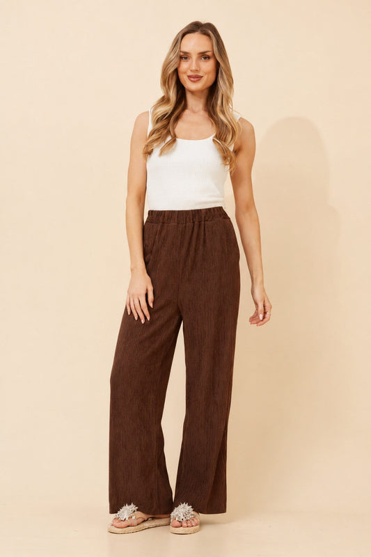 Image of a model wearing Pants. Product name - MERCER SOLID WIDE LEG PANTS in Chocolate colour by brand - Caroline Morgan Australia
