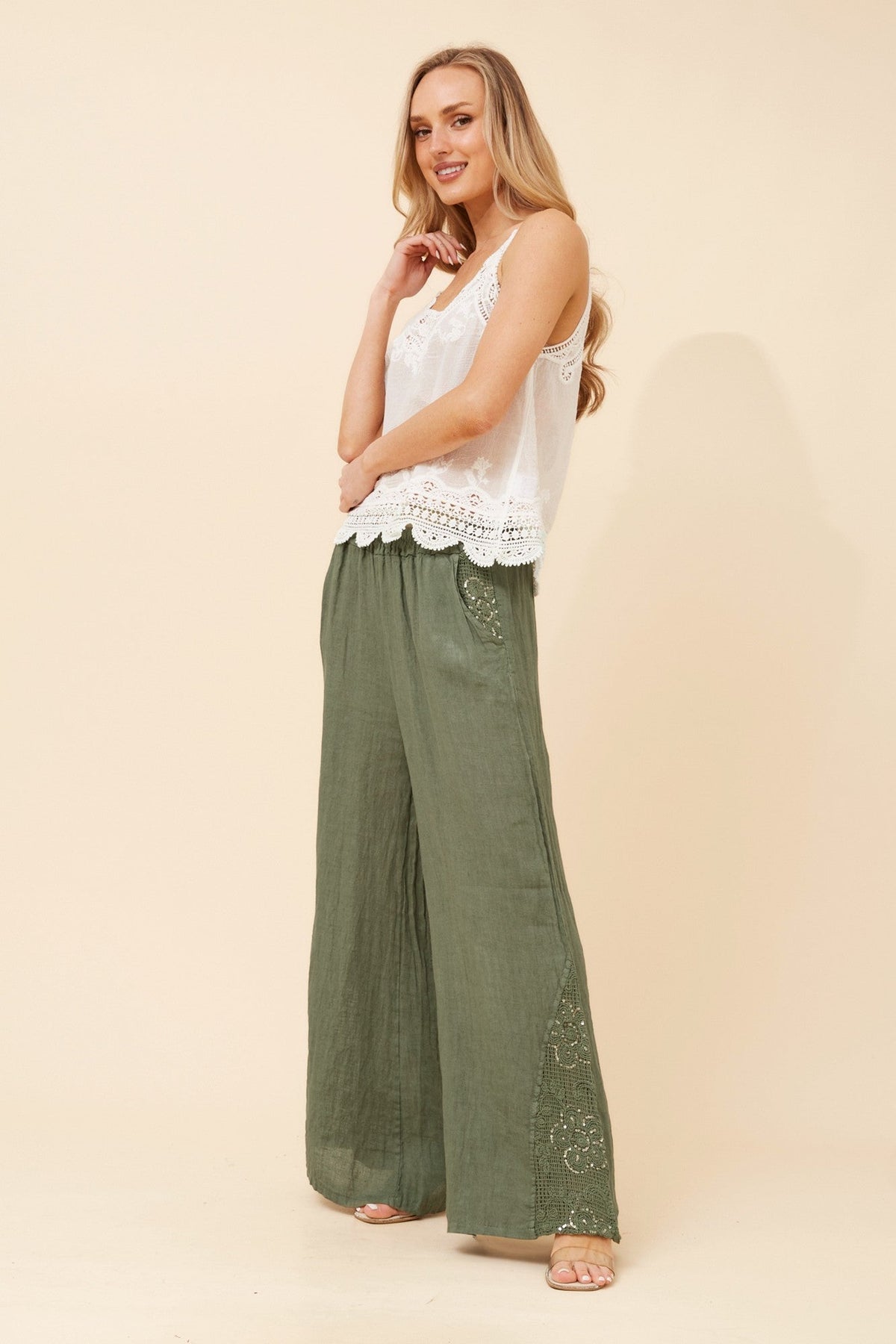 Image of a model wearing Pants. Product name - WALTER LINEN WIDE LEG PANTS in Chocolate colour by brand - BOTTEGA MODA