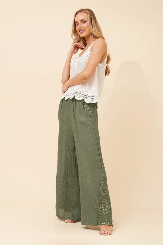 Image of a model wearing Pants. Product name - WALTER LINEN WIDE LEG PANTS in Chocolate colour by brand - BOTTEGA MODA