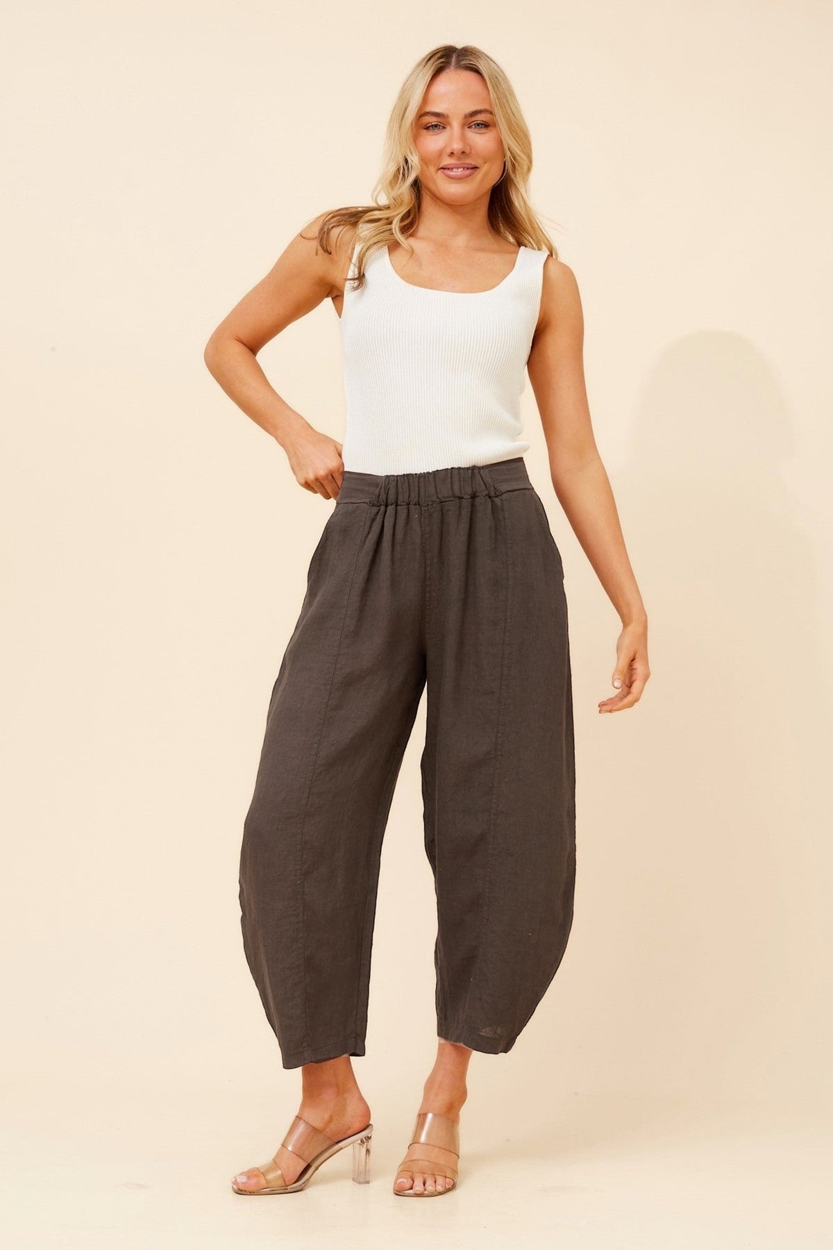 Image of a model wearing Pants. Product name - VITTORIA SOLID PANTS in Chocolate colour by brand - BOTTEGA MODA