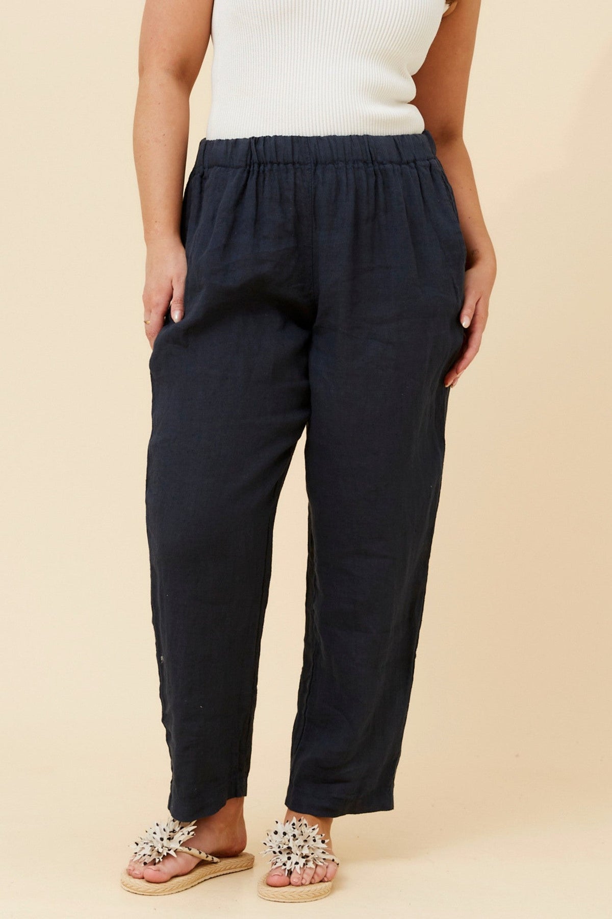 Image of a model wearing Pants. Product name - JOURNEE SOLID LINEN PANTS in Navy colour by brand - BOTTEGA MODA