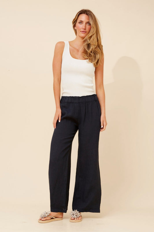 Image of a model wearing Pants. Product name - OSANNA WIDE LEG LINEN PANTS in Chocolate colour by brand - BOTTEGA MODA