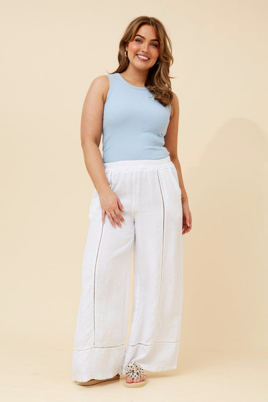 Image of a model wearing Pants. Product name - TEODORA LINEN WIDE LEG PANTS in Bitter Chocolate colour by brand - BOTTEGA MODA