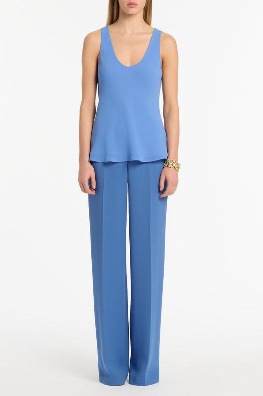 Image of a model wearing Tops. Product name - Pacific Blue Georgette Scoop Neck Cami in Blue colour by brand - Carla Zampatti