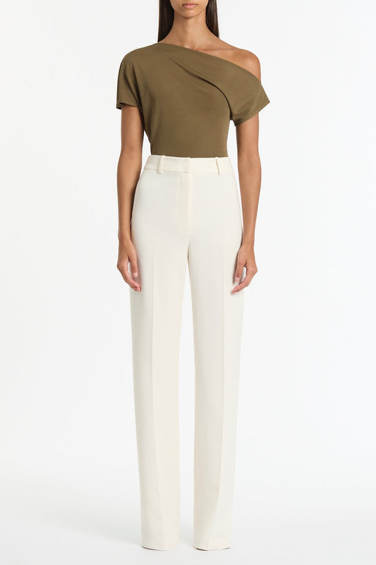 Image of a model wearing Tops. Product name - Palm Matte Jersey Off-Shoulder Top in Green colour by brand - Carla Zampatti