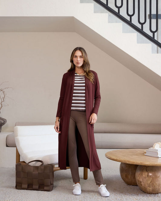 Image of a model wearing Pants. Product name - Patti Bamboo Full-Length Pant Chocolate in Chocolate colour by brand - Lou Lou