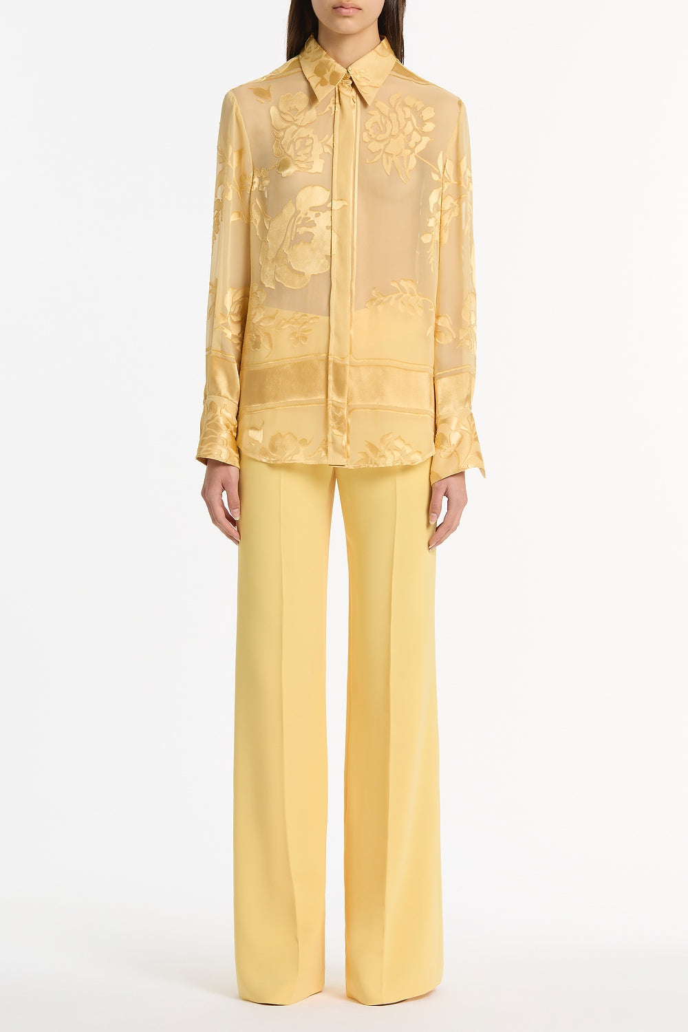 Image of a model wearing Tops. Product name - Pollen Devore Relaxed Shirt in Yellow colour by brand - Carla Zampatti