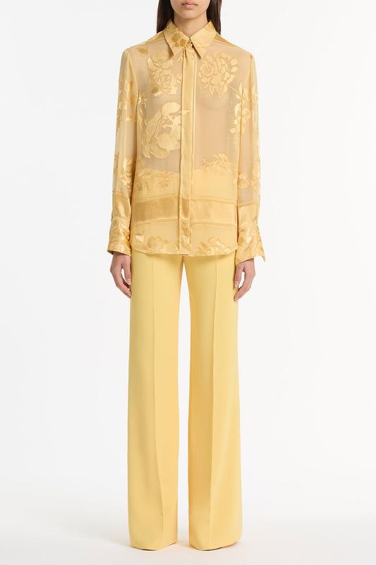 Image of a model wearing Tops. Product name - Pollen Devore Relaxed Shirt in Yellow colour by brand - Carla Zampatti