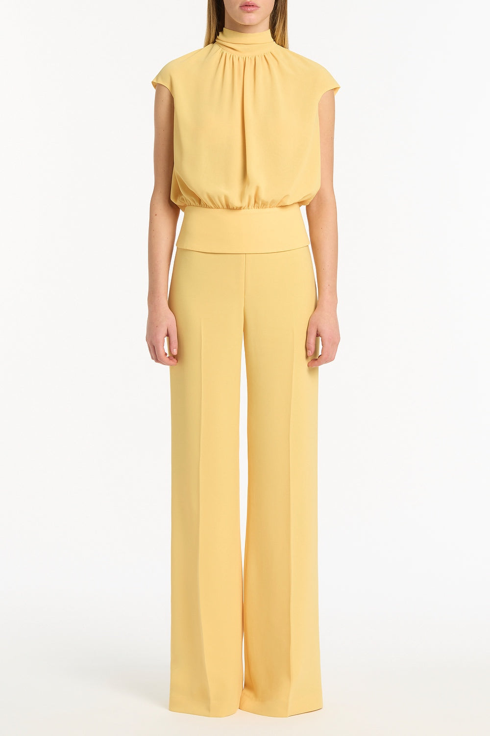 Image of a model wearing Tops. Product name - Pollen Georgette Scarf Top in Yellow colour by brand - Carla Zampatti