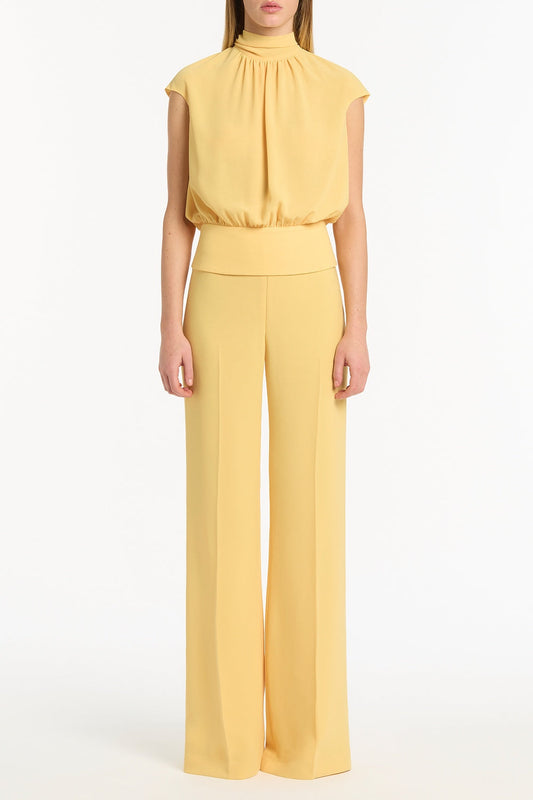 Image of a model wearing Tops. Product name - Pollen Georgette Scarf Top in Yellow colour by brand - Carla Zampatti