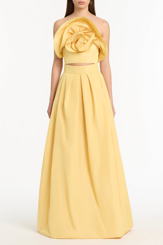 Image of a model wearing Tops. Product name - Pollen Taffeta Flower Top in Yellow colour by brand - Carla Zampatti