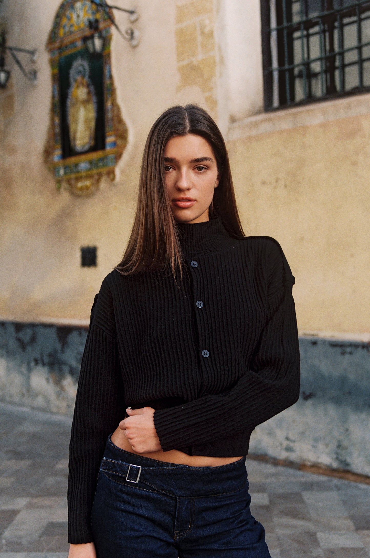 Image of a model wearing Outerwear. Product name - Pressley Sweater in Black colour by brand - With Jéan