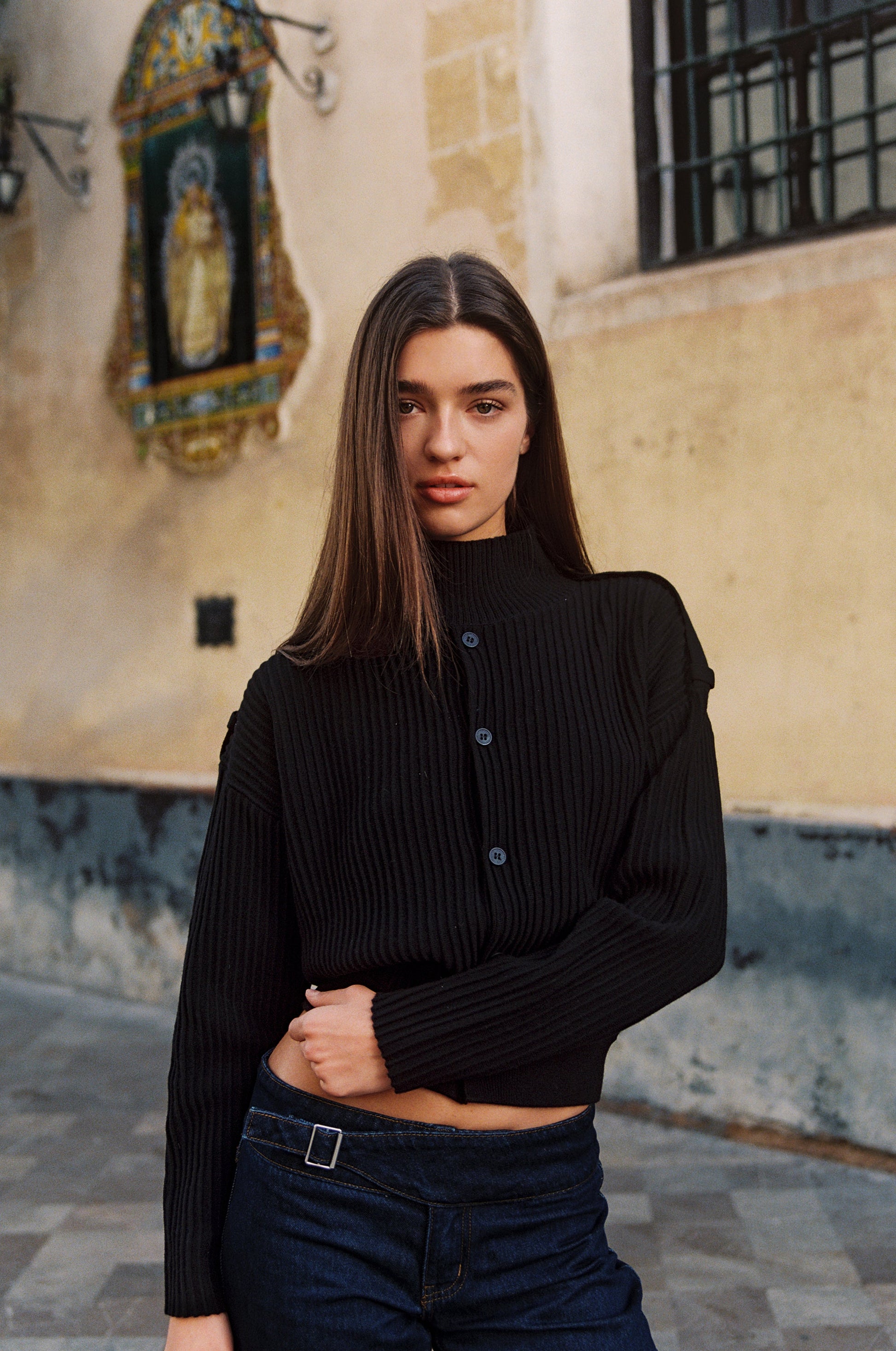 Image of a model wearing Outerwear. Product name - Pressley Sweater in Black colour by brand - With Jéan