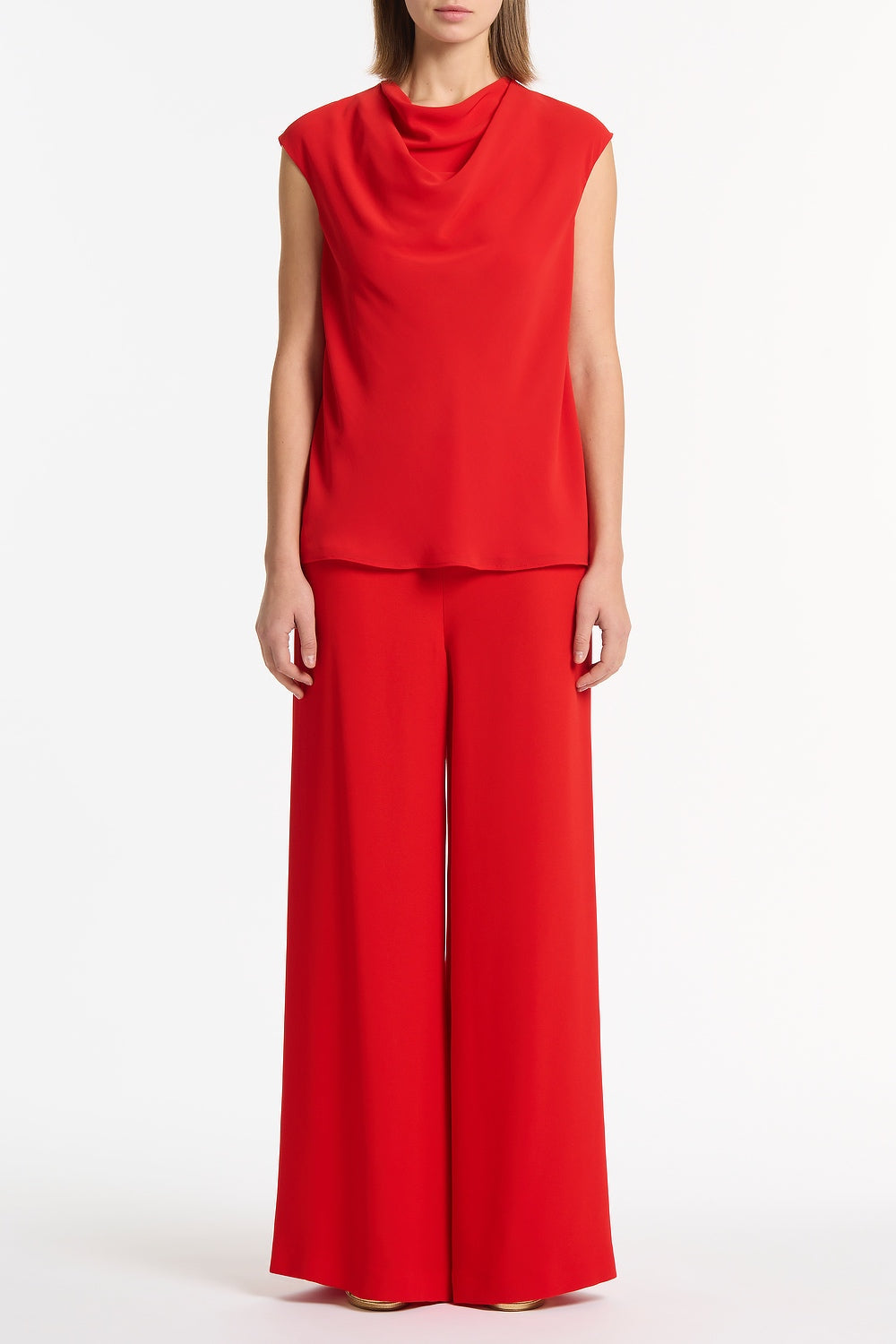 Image of a model wearing Tops. Product name - Red Georgette Cap Sleeve Cowl Top in Red colour by brand - Carla Zampatti