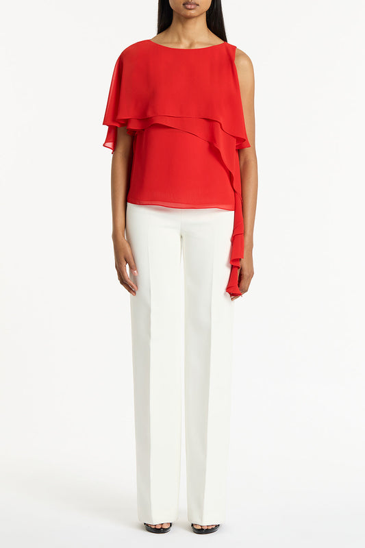 Image of a model wearing Tops. Product name - Red Georgette High Low Top in Red colour by brand - Carla Zampatti