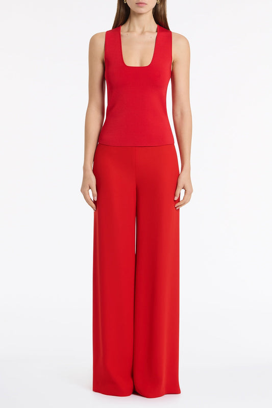 Image of a model wearing Tops. Product name - Red Milano Knit Tank in Red colour by brand - Carla Zampatti