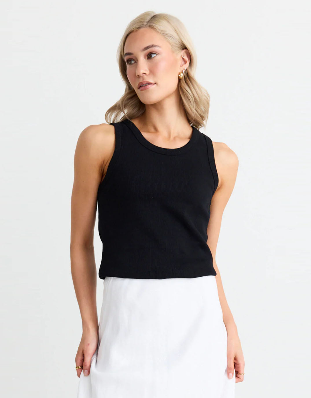 Image of a model wearing Tops. Productname: Cobble Rib Cutaway Tank - in Black colour by brand - Re:Union The Label