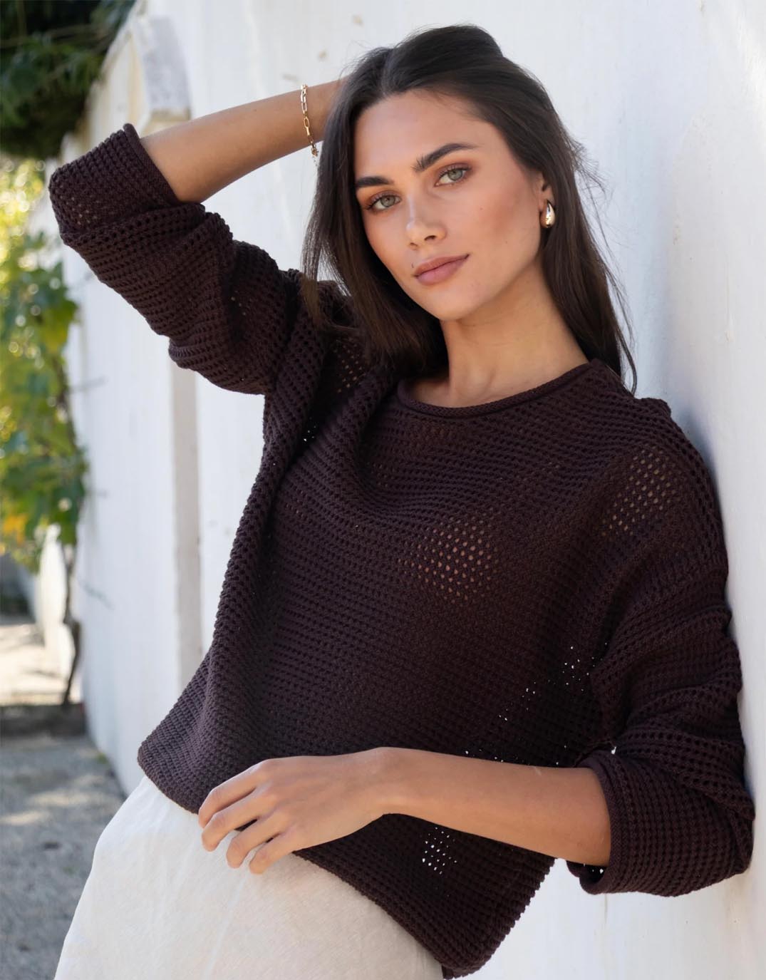 Image of a model wearing Outerwear. Productname: Dawn Crochet Knit Jumper - in Chocolate colour by brand - Re:Union The Label