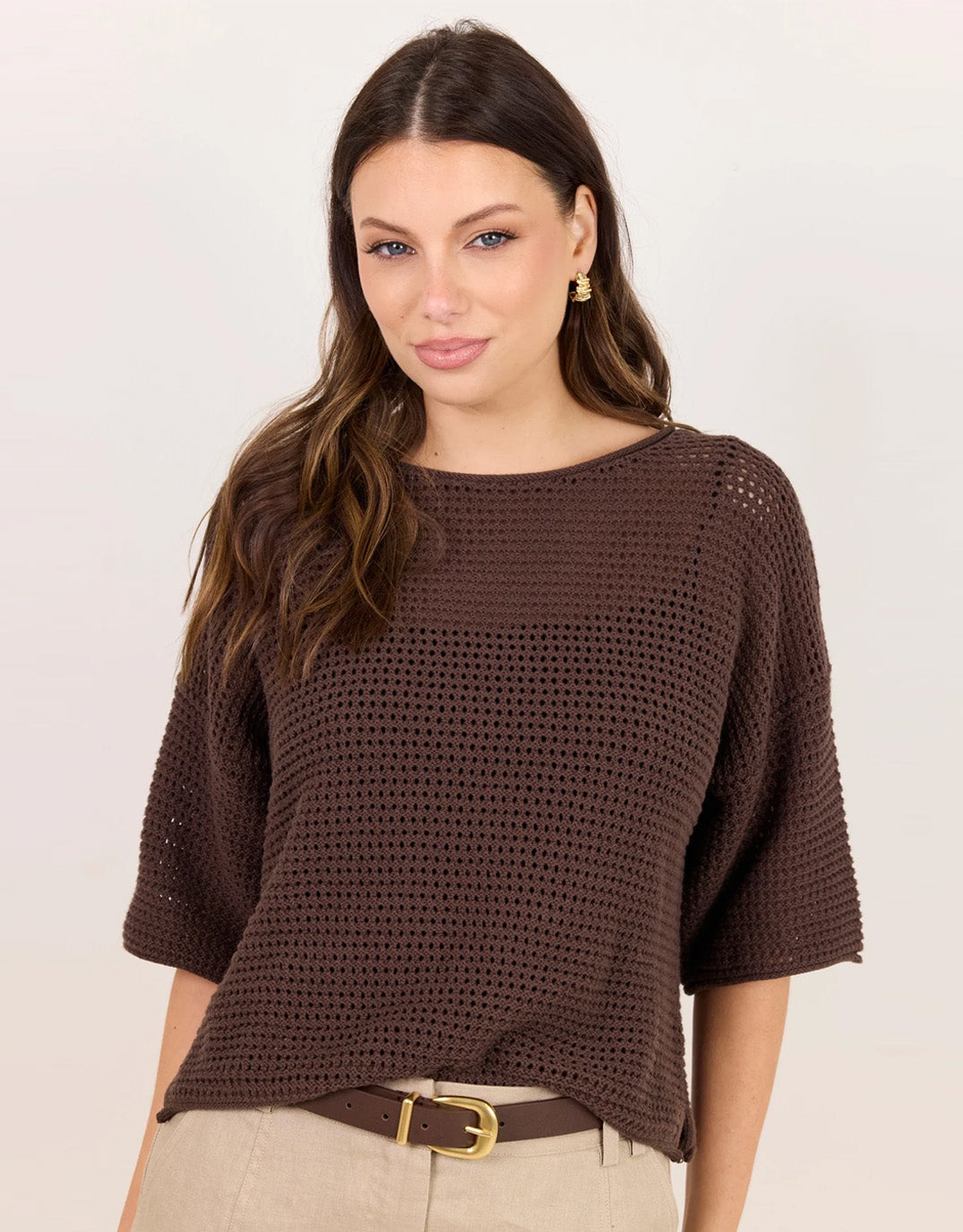 Image of a model wearing Outerwear. Product name - Sunrise Crochet Knit Top Chocolate in Chocolate colour by brand - Re:Union The Label