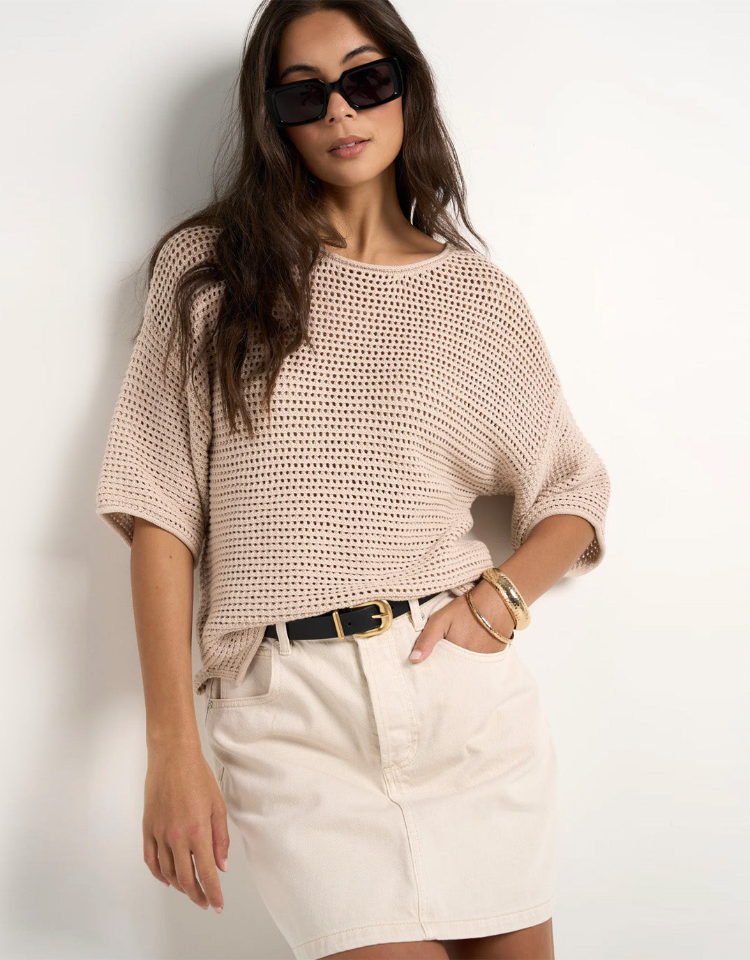 Image of a model wearing Outerwear. Product name - Sunrise Crochet Knit Top String in String colour by brand - Re:Union The Label