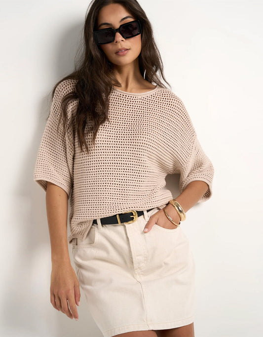 Image of a model wearing Outerwear. Product name - Sunrise Crochet Knit Top String in String colour by brand - Re:Union The Label
