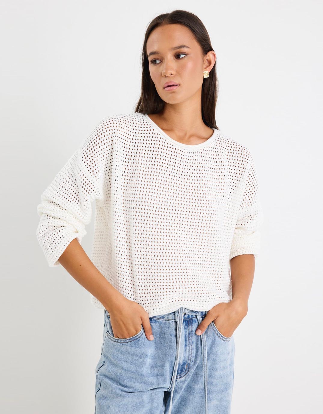Image of a model wearing Outerwear. Productname: Dawn Crochet Knit Jumper - in Ivory colour by brand - Re:Union The Label