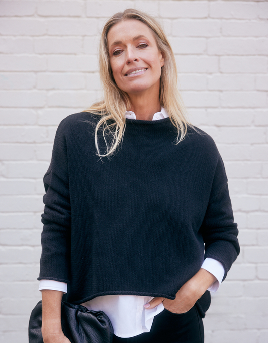 Image of a model wearing Tops. Product name - Rilee Sweater Black in Black colour by brand - White by FTL