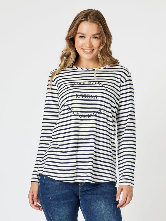 Image of a model wearing Tops. Product name - Riviera Stripe Print Long Sleeve Tee Navy/White in Navy/White colour by brand - Threadz