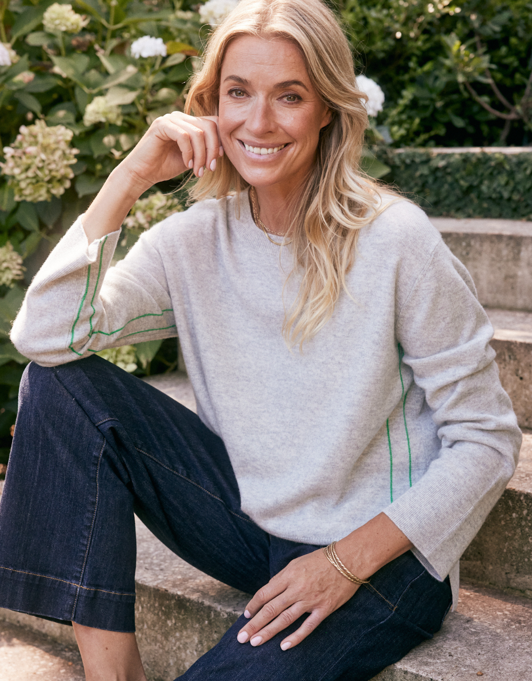 Image of a model wearing Outerwear. Product name - Riviera Wool Cashmere Knit Grey Marle in Grey Marle colour by brand - White & Co.