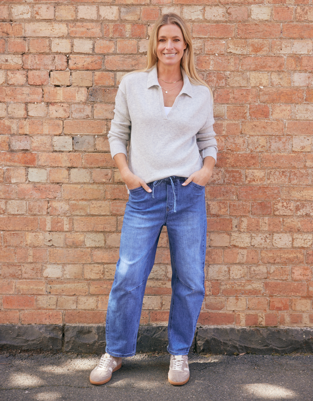 Image of a model wearing Outerwear. Product name - Provence Wool Cashmere Collared Knit Grey Marle in Grey Marle colour by brand - White & Co.
