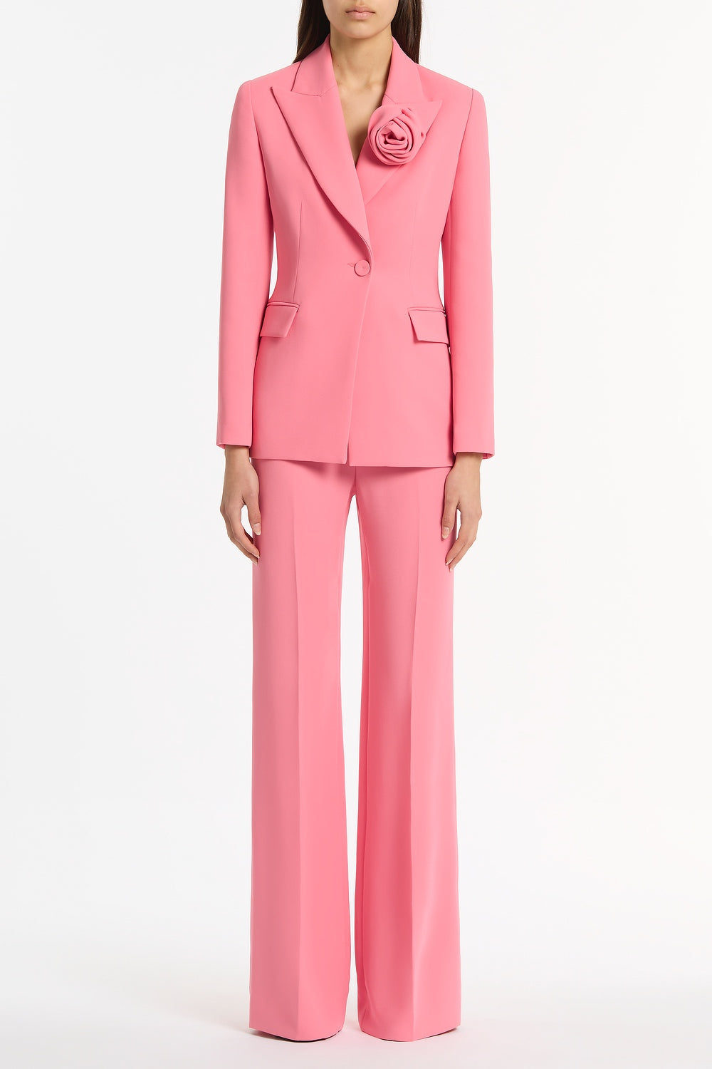 Image of a model wearing Pants. Product name - Rose Pink Crepe Classic Flared Pant in Pink colour by brand - Carla Zampatti